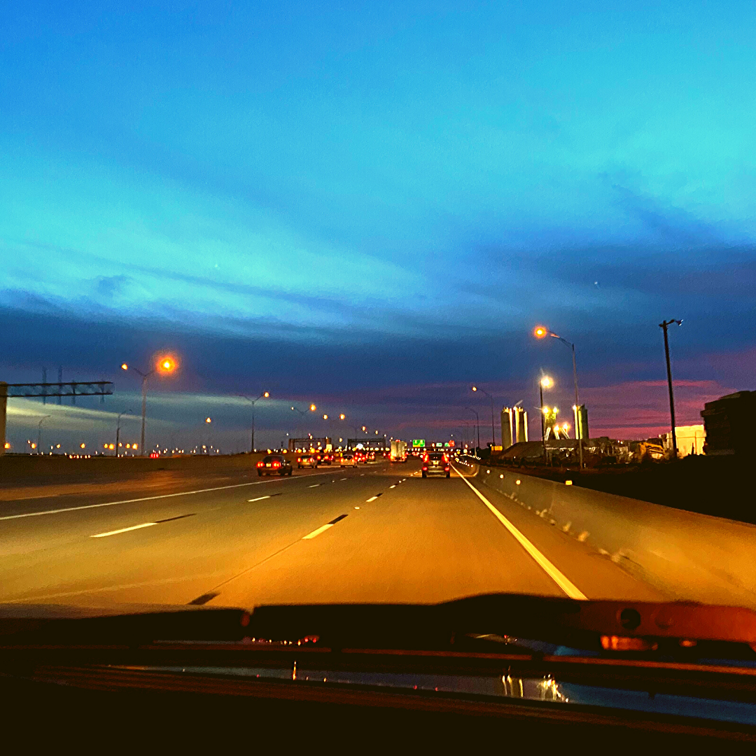 dashboard view of highway at sunset in Grapevine Texas