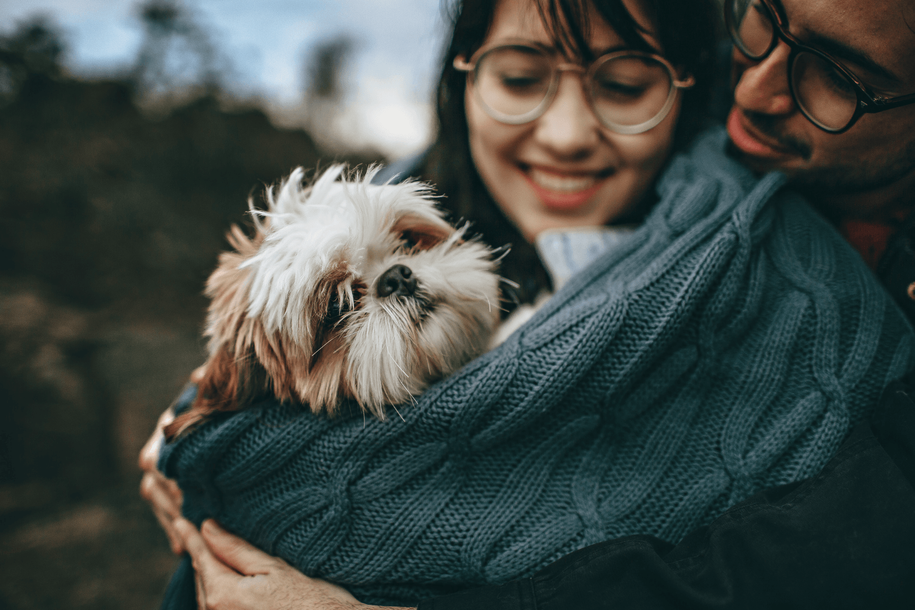 Couple holds dog