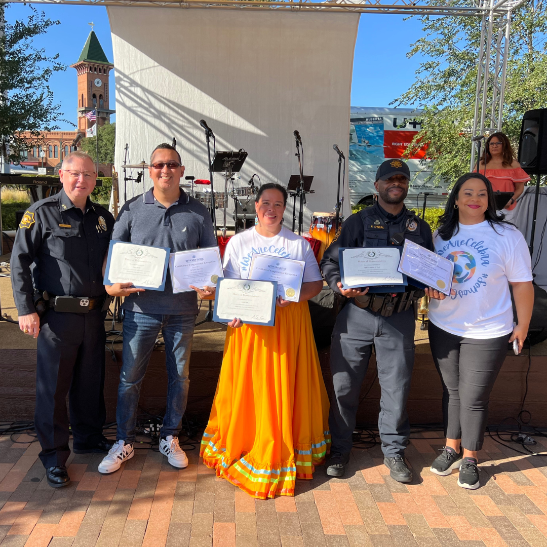 Latino Service Awards winners holding certificates